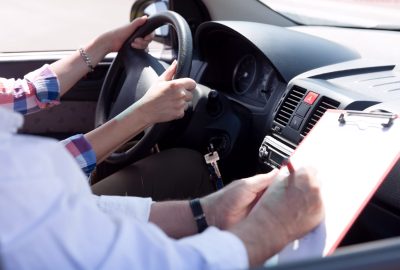Learning to drive a car. Driving school. Driver education.